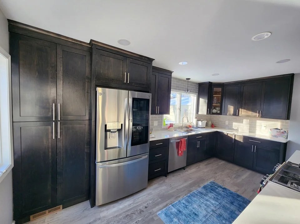A custom kitchen with wood cabinetry and a wide island in Richfield, Minnesota