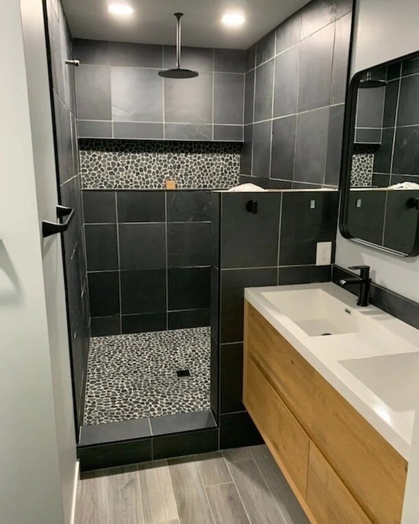 A new master bathroom with a walk-in shower and a double vanity in Shakopee, Minnesota